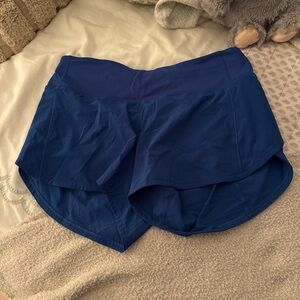 Royal Blue Athletic Shorts with Curved Hem and Stretchy Fit